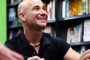 Andre Agassi signs copies of his autobiography, Open, at Paper Plus Newmarket. Photo / Getty Images.