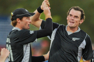 New Zealand's Kyle Mills celebrates with Martin Guptill of New Zealand. Photo / AP.