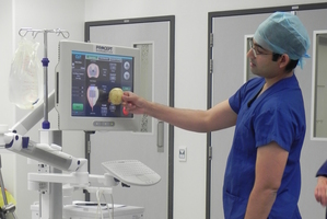 Surag Mantri, director of Procept, demonstrates the technology of the future in which the machine is told what to do by surgeons. Photo / BOP District Health Board