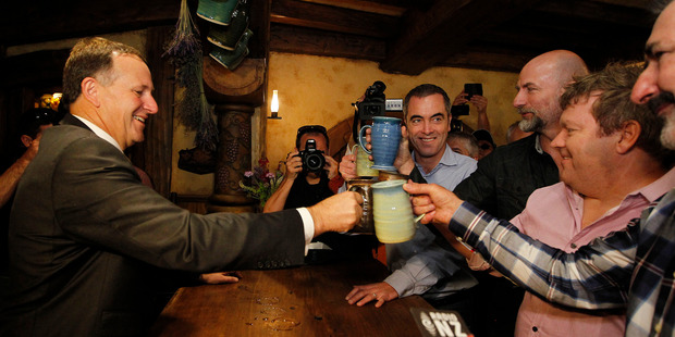 John Key, accused of having a "taste for celebrity" shared a beer with actors from 'The Hobbit' after last year's Hollywood trip. Photo / Christine Cornege