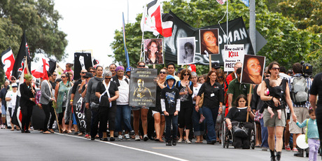 Hundreds of people march down Bank St in Whangarei to raise awareness about domestic violence. Photo / Michael Cunningham