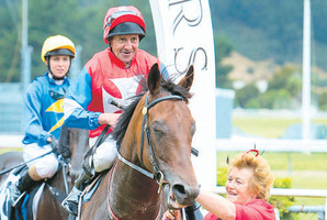 A happy co-trainer Karen Parsons brings Final Touch back to scale with jockey Chris Johnson on board. Photo / Hagen Hopkins