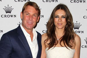 Elizabeth Hurley with her fiancée Shane Warne. The pair plan to get married this year.Photo / AFP