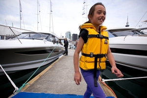 Anneliese Parsons, 8, from Bucklands Beach in her new lifejacket at the Auckland boat show. Photo / Dean Purcell