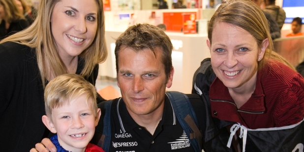 Team NZ skipper Dean Barker with Tracy Scans, Harry Wurr and Nicky Wurr at the airport. Photo / Greg Bowker