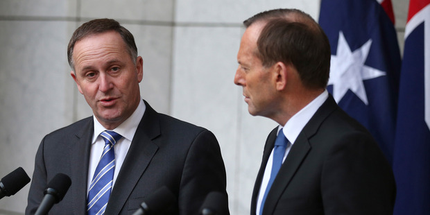 John Key says New Zealand totally respects the sovereign right of Tony Abbott's Government to make decisions on how to treat people who work in Australia. Photo / AP
