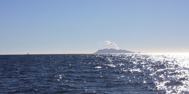 White Island steams away on the distant horizon. Photo / Paul Rush