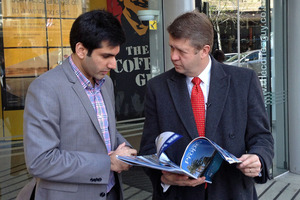 Labour leader David Cunliffe, right, meets first home buyer Kanik Mongia. Photo / Brendan Manning