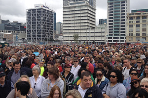 Thousands wait to welcome home Team NZ. Photo / Greg Bowker