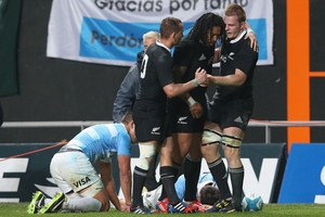 Sam Cane, right, is congratulated by Ma'a Nonu and Aaron Cruden after scoring the second try against Argentina yesterday. Photo / Getty Images