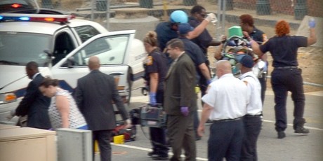 Capitol Hill police and medics take a shooting victim away on a stretcher. Photo / AFP