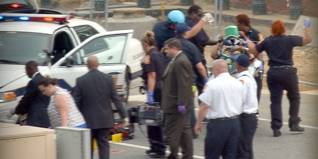 Capitol Hill police and medics take a shooting victim away on a stretcher. Photo / AFP