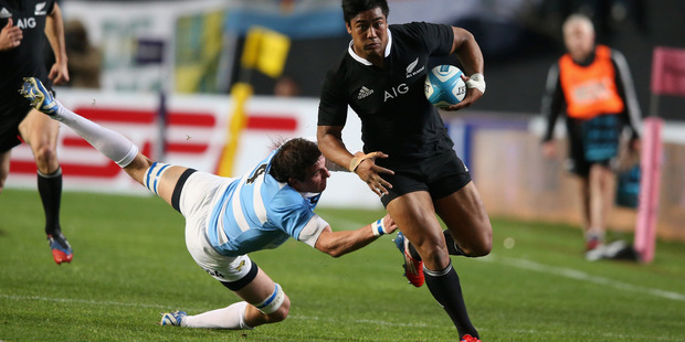 Julian Savea of the All Blacks breaks clear of Julio Farias Cabello and heads for the tryline during today's match. Photo / Getty Images