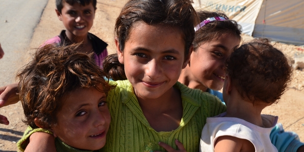 Children flock around visitors in Zaatari camp, Jordan's fourth largest city. Photo / Kate Shuttleworth