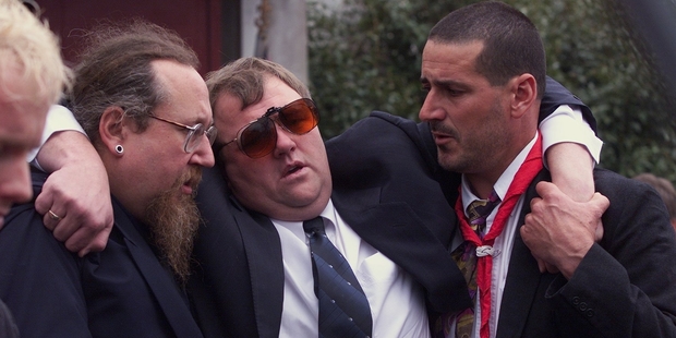 Mark Lundy is supported by friends at the funeral of his wife and daughter. He was arrested months later.