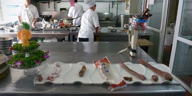 (from R to L) the penis of horse, donkey, deer, Russian dog and goat in the kitchen of a hotpot restaurant in Beijing.Photo / AFP