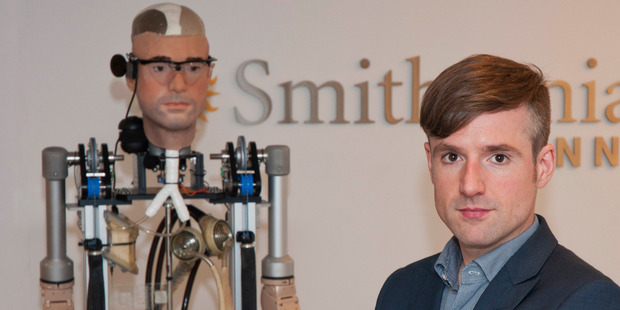 Bertolt Meyer, a social psychologist for the University of Zurich, poses next to the real life bionic man. Photo / AP