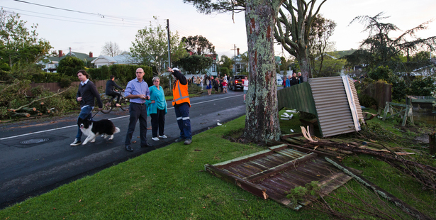 Devonport residents talk with local board member Chris Darby as they inspect the damage. Photo / Brett Phibbs