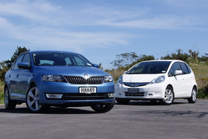 The Skoda Rapid (front) lines up well against Honda's hybrid model Jazz. Pictures / David Linklater