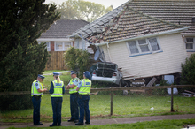 Police and emergency services are working at the scene of the car crash in Otara. Photo / Sarah Ivey