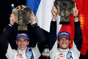 Sebastien Ogier, right, and co-driver Julien Ingrassia, both from France, celebrate their win in the Rallye de France and in their world champions title in Strasbourg, France. Photo / AP