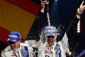 Sebastien Ogier, right, and co-driver Julien Ingrassia, both from France, celebrate their win in the Rallye de France and in their world champions title in Strasbourg. Photo / AP