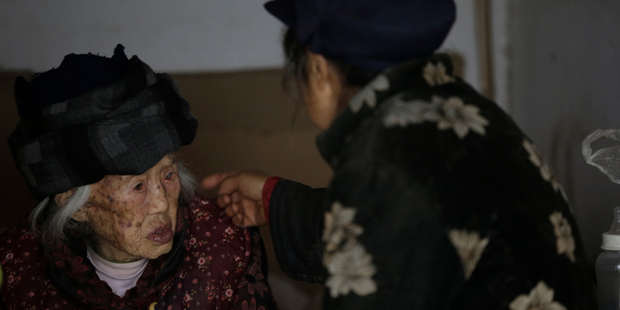 Zhang Zefang, a 94-year old woman who sued her own children for not taking care of her, left, and Kuang Shiying, Zhang's daughter-in-law. Photo / AP