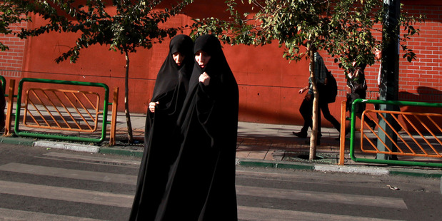 Iranian women are ordered to cover up from head to toe, but Iran's new president says police shouldn't be harsh in enforcing that rule. Photo / AP