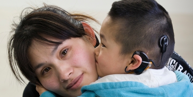 Mei Yang says Manukau DHB should pay her son's hearing costs for life. Photo / Greg Bowker