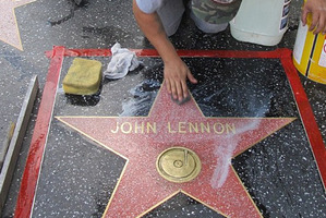 John Lennon's star on the Walk of Fame is scrubbed clean. Photo / AP