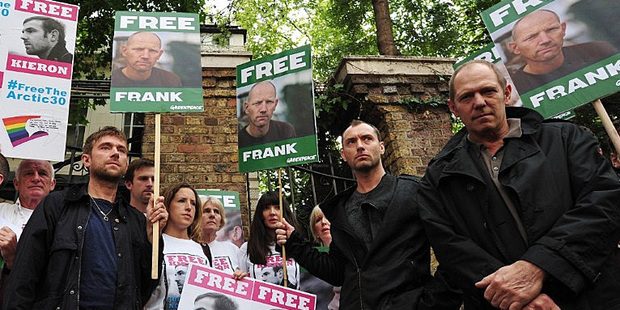 Damon Albarn, left, Jude Law and Paul Simonon take part in a protest against the detention of Greenpeace activists in Russia. Photo / AP