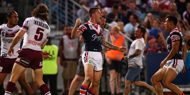 Shaun Kenny-Dowall of the Roosters celebrates his try during the 2013 NRL Grand Final match. Photo / Getty Images