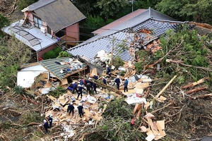 Deadly mudslides have demolished or swept away several houses on the Pacific
island of Oshima, about 120km south of Tokyo. Photo / AP