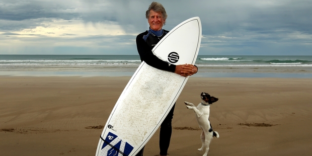 David Timbs enjoys an outing at Wainui Beach with his dog, Bosco. Photo / Alan Gibson