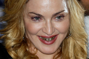 Madonna has been banned from an American movie chain over reports she texted during a screening. Photo / AP
