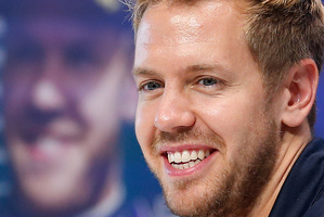 With fresh hard tires, Sebastian Vettel blasted past Grosjean on lap 41 to take the lead for good. Photo / AP