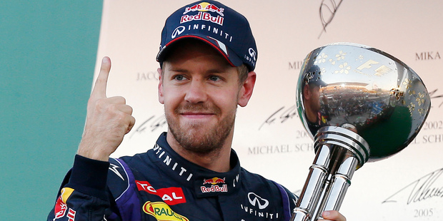 Red Bull driver Sebastian Vettel of Germany celebrates after winning the Japanese Formula One Grand Prix at the Suzuka circuit in Suzuka, Japan. Photo / AP