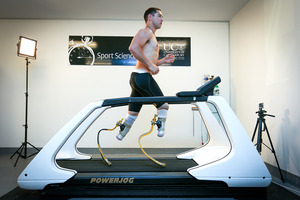 19-year-old University of Canterbury commerce student, Liam Malone, who lost both legs at the age of two, trials his new running-blades for the first time on a treadmill. Photo / Martin Hunter.