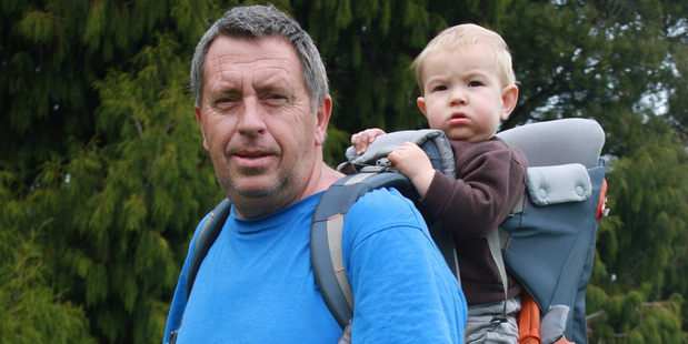 Alan Barrett and his grandson Eli. Three generations of the Barrett family have farmed on the Taranaki property designated as a 'significant natural area'.