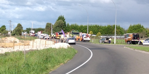 A woman had to be cut free after a log fell on to her car near Paengaroa yesterday.