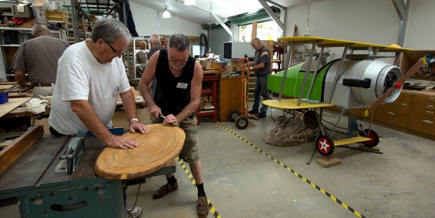 Laurie Gibbs (left) and Martin Adlington work in the Men's Shed North Shore in Glenfield. Photo / Brett Phibbs