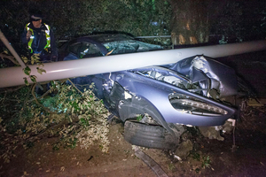 Photos of the crash opposite the Royal Akarana Yacht Club showed substantial damage to the front of the car Photo / SNPA