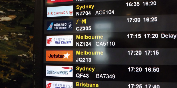 Auckland Airport's new display boards show flight details in Mandarin as well as English.