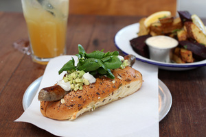 The Paua Dog with vege chips and a lemon, honey and mint drink. Photo / Chris Gorman