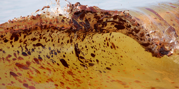 Large amounts of crude oil battered the Alabama coast, leaving deposits of the slick mess some 10-15cm thick on the beach.