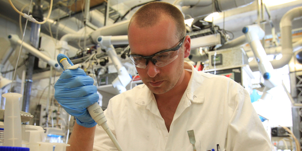 A scientist at biofuels developer LanzaTech in Auckland, working in their laboratory. Photo / Greg Bowker
