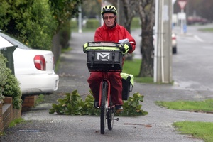 Postman on his round in Totara Street, Masterton. Photo / APN