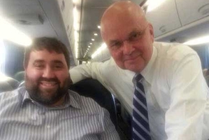Blogger Tom Matzzie (left) plucked up the courage to ask Michael Hayden for a photo after the train indiscretions.