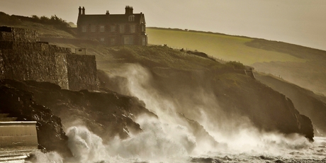 Waves crash onto the cliffs surrounding Porthleven, Cornwall, in southwest England yesterday. Photo / AP