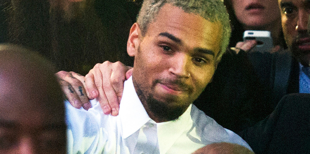 Singer Chris Brown departs the H Carl Moultriel courthouse in Washington. Photo / AP